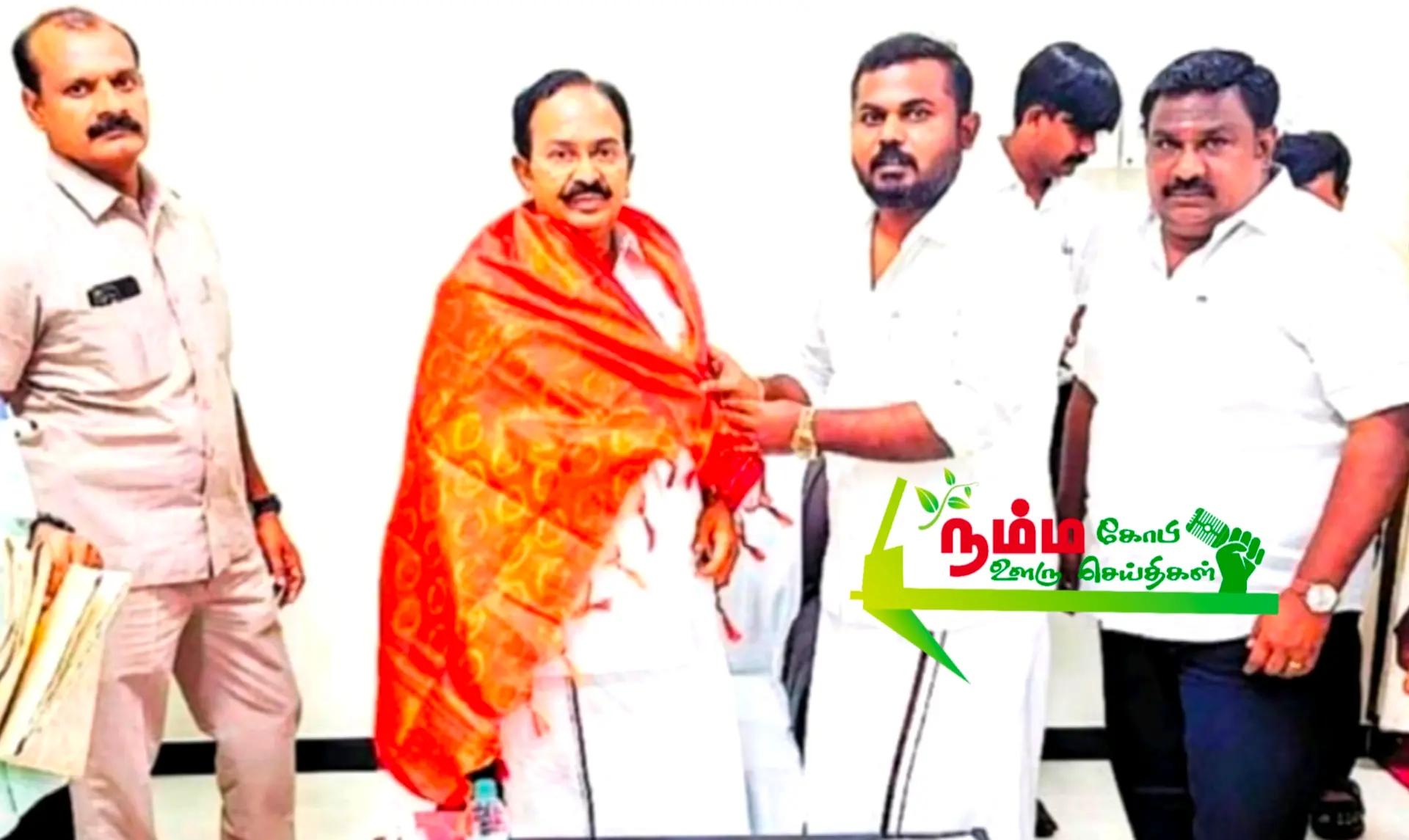 In honor of Minister R. Rajendran, Erode North District Student Organizer and Election Officer for Veerapandi Constituency, Dr. TK Krupakaran went in person and congratulated him wearing a bonnet.