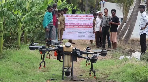 Agriculture college students and agriculture department officials explained the process of drone spraying to farmers in Koogalur area near Kopisettipalayam.