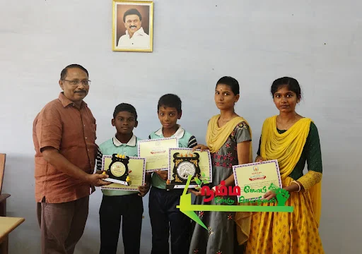 Nambiyur Kumuda metric school students won the district and state-wide World Austerity Day Festival.
